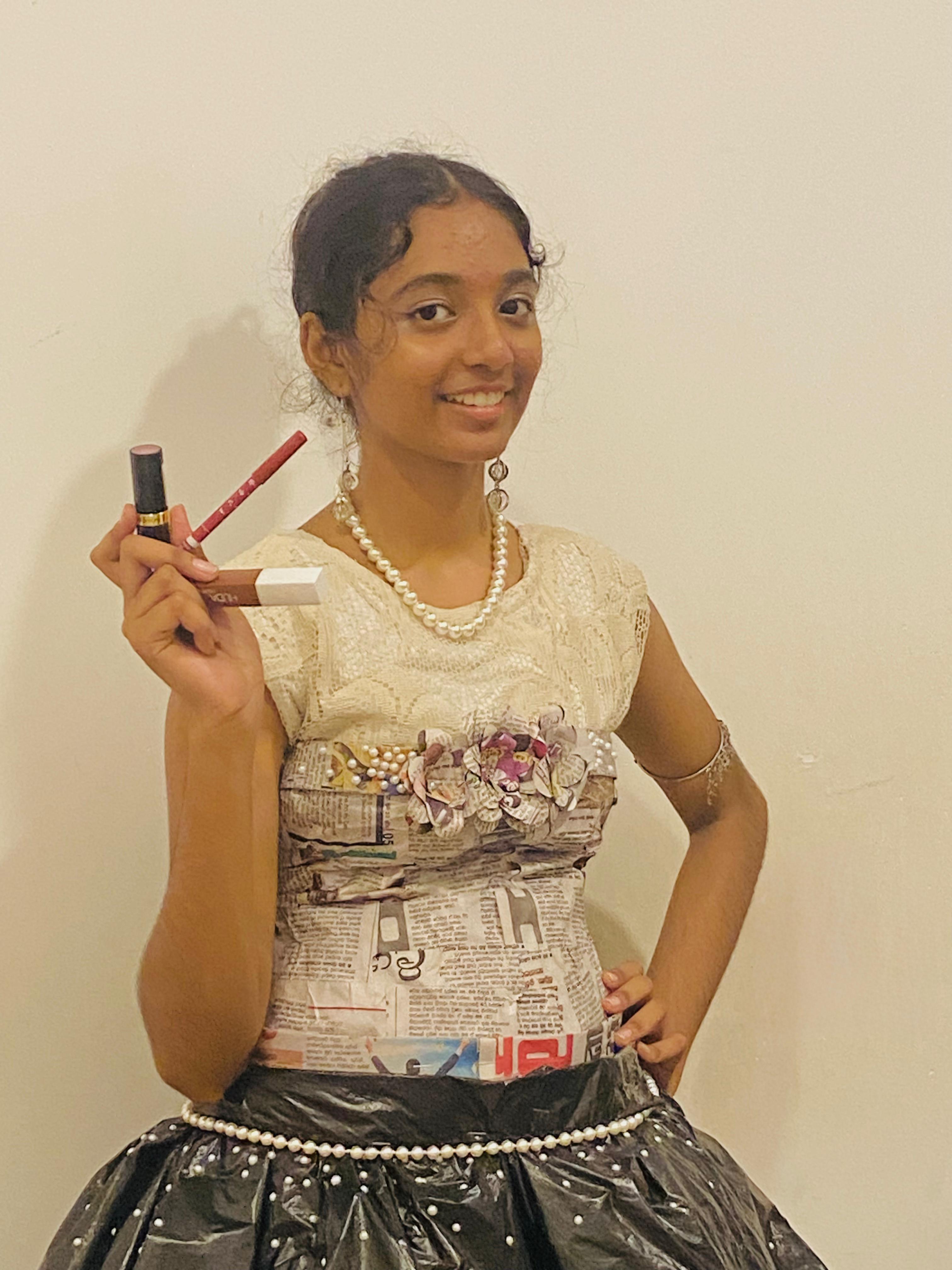 A girl holding some cosmetics